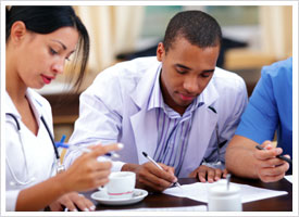 certified nurse colleagues at table