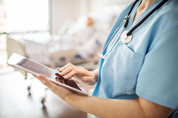 nurse on tablet