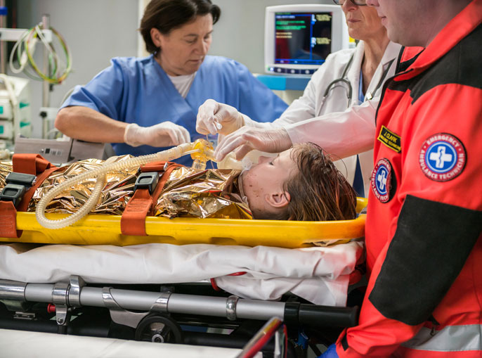 nurse oxygen mask young patient