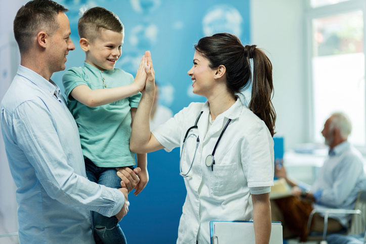 pediatric nurse with young patient