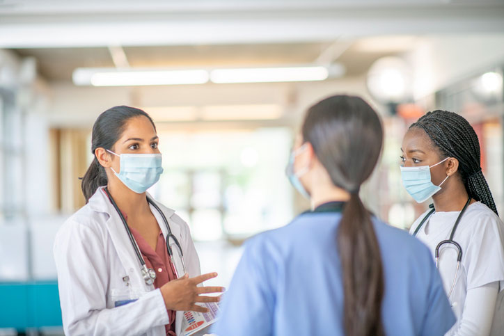 healthcare professionals huddle