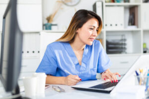 nurse working computer desk