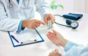 Nurse practitioner prescribing medicine to patient
