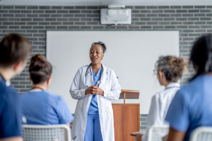 nurse leading meeting