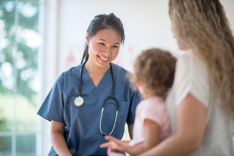 nurse talking to mom and toddler